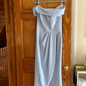 Off the shoulder light blue dress .